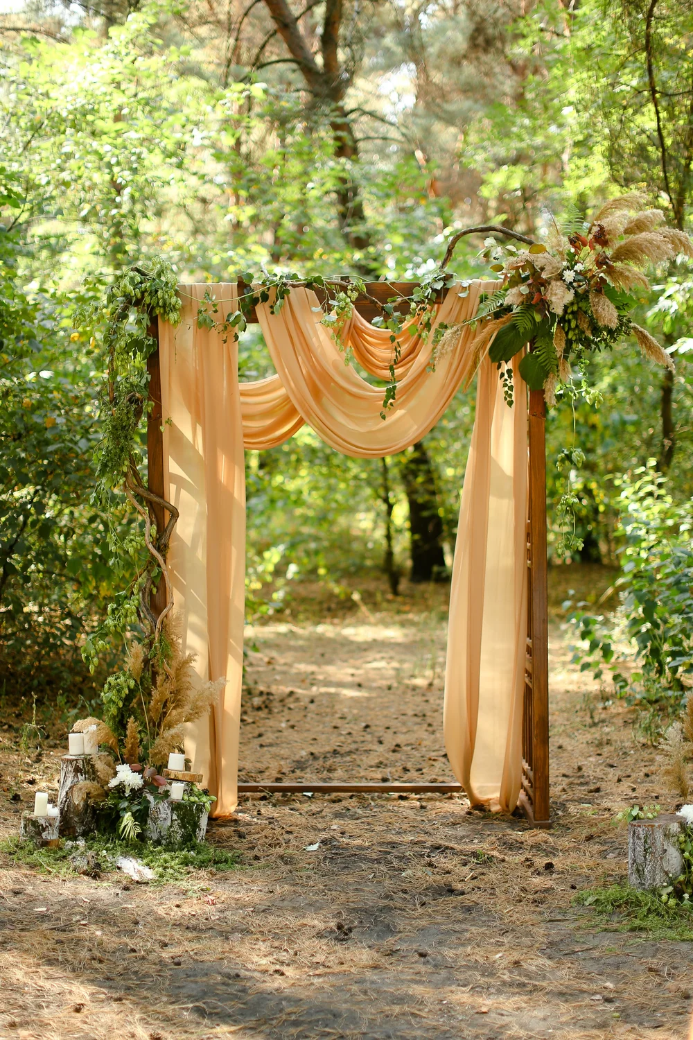 Draping fabric on a wedding arch